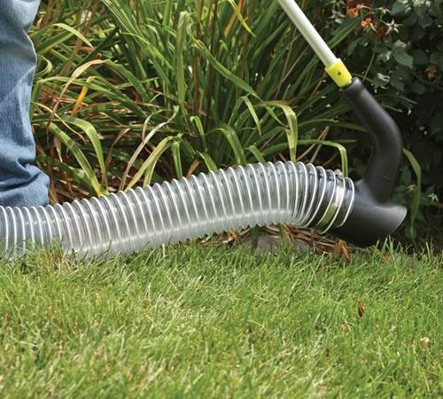 it13f1pzxpj.jpg - Mowers Online Garden hose laying on lawn grass