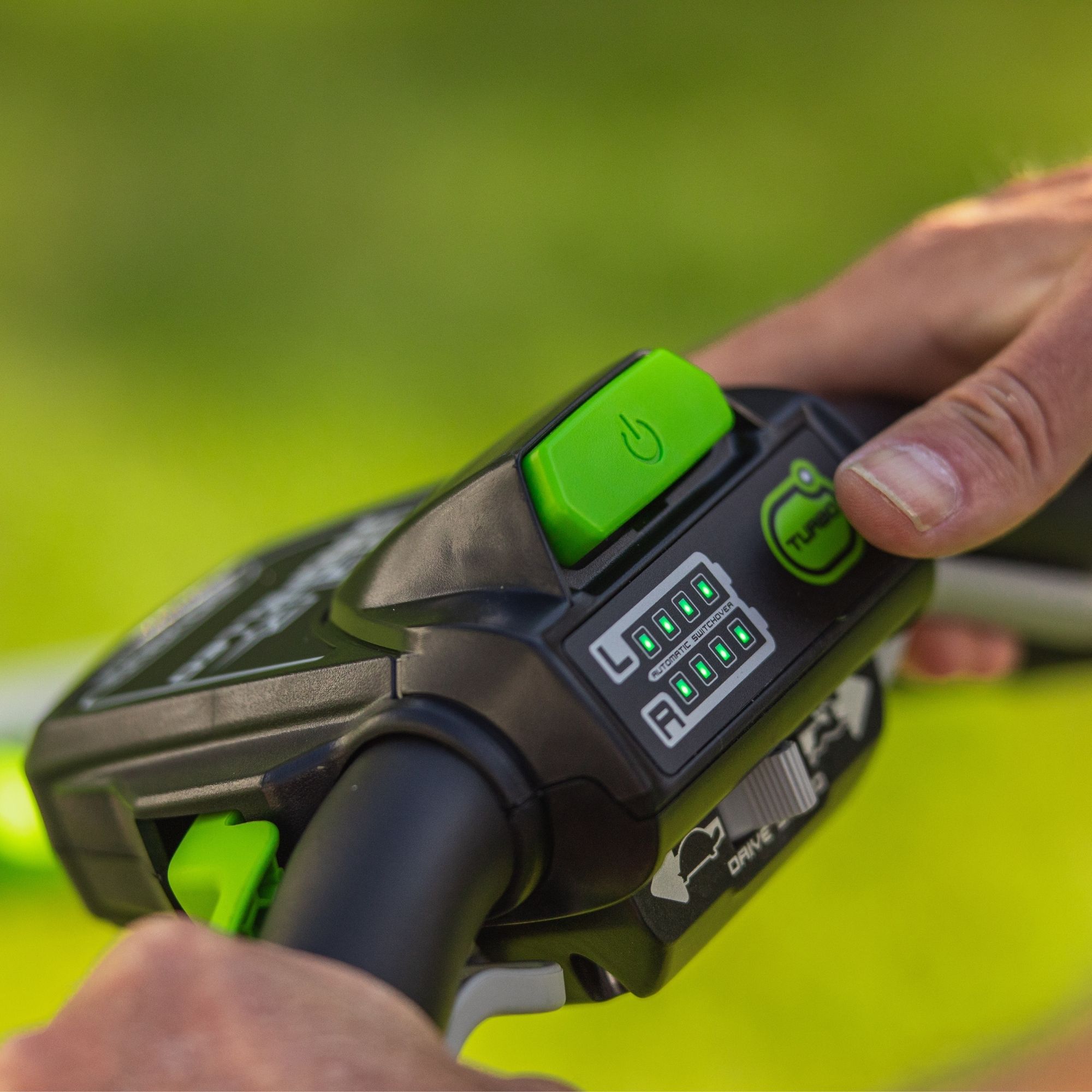 tqare5g0ddt.jpg - Mowers Online Handheld green and black tactical device with LCD display